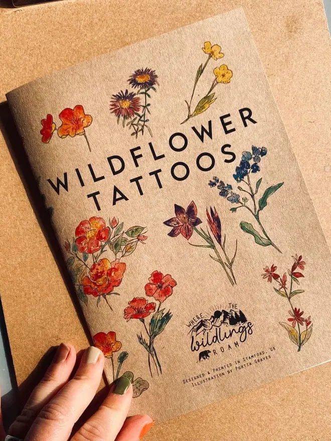 Nature Botanical Temporary Tattoos,  a brown kraft paper booklet titled "WILDFLOWER TATTOOS" featuring various colourful botanical illustrations and the logo "Where the Wildlings Roam."