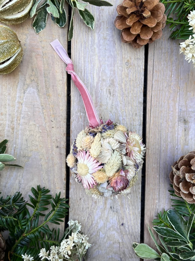 Pastel Dried Flower Bauble. A bauble made of dried pastel flowers.