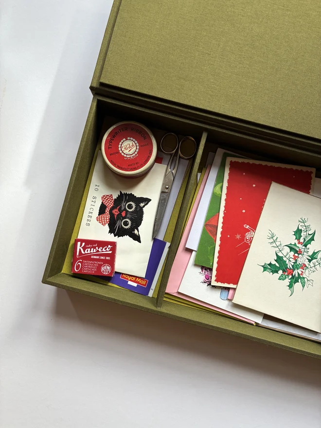 Open handmade Christmas Correspondence box in Olive green cloth displaying cards and stationery items