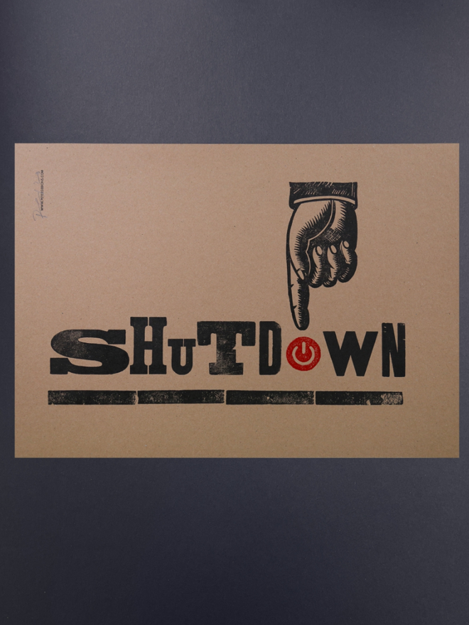 Shutdown Print. A print on brown background with lettering of varying size and font.