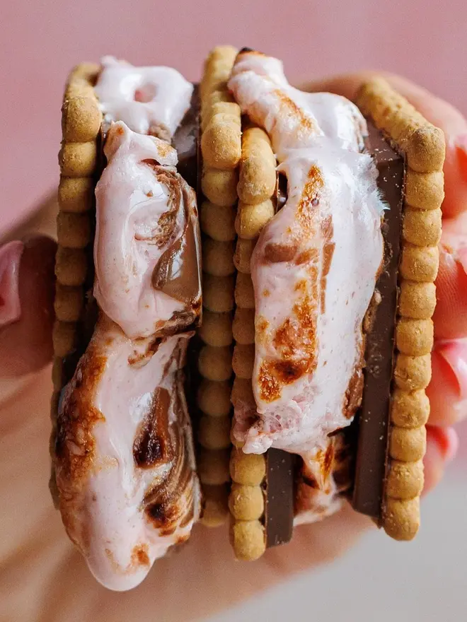Date Night S'mores And Hot Chocolate Kit, two of the biscuits sandwiched together with valentines wonder fluff in the middle. 