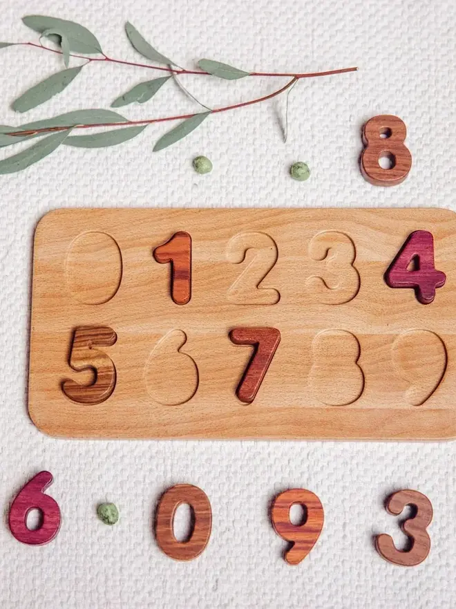 Wooden Number Puzzle Heirloom Toy, on a table. 