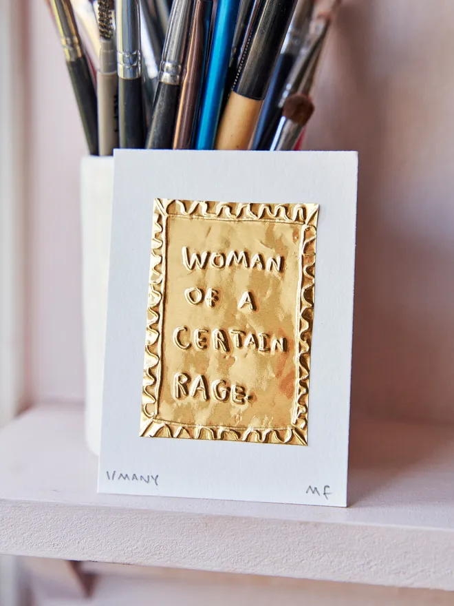 'Woman Of A Certain Rage' Gold Tin Embossing