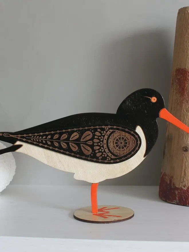Standing Wooden Oyster Catcher, wooden bird decoration standing on a platform. 