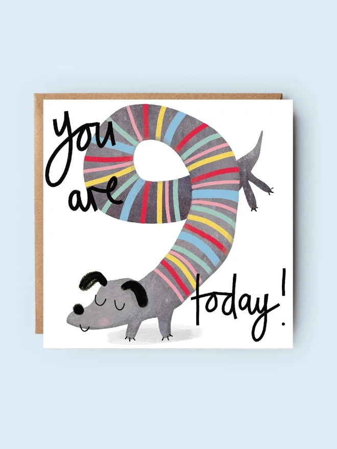 '9 today' illustrated birthday card. birthday card featuring a stripy sausage dog shaped into the number 9.