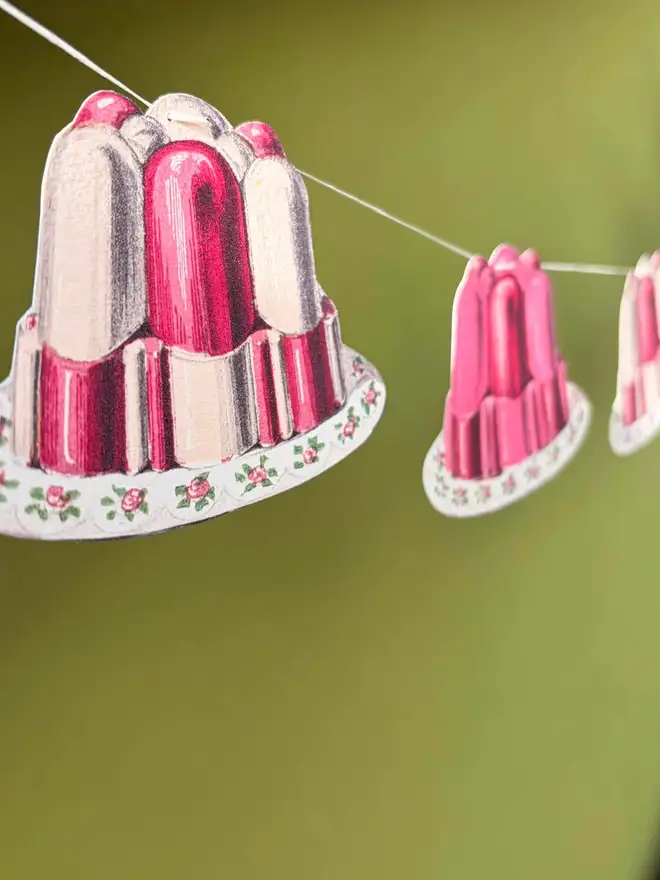 A garland of jelly shaped bunting in fruit salad colours