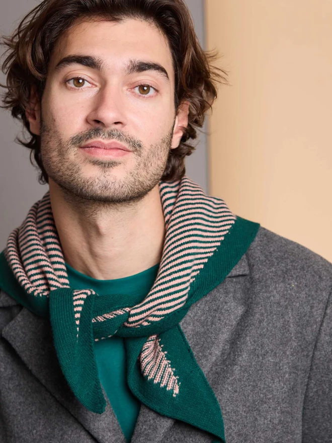 man wearing green and pink striped wool neckerchief