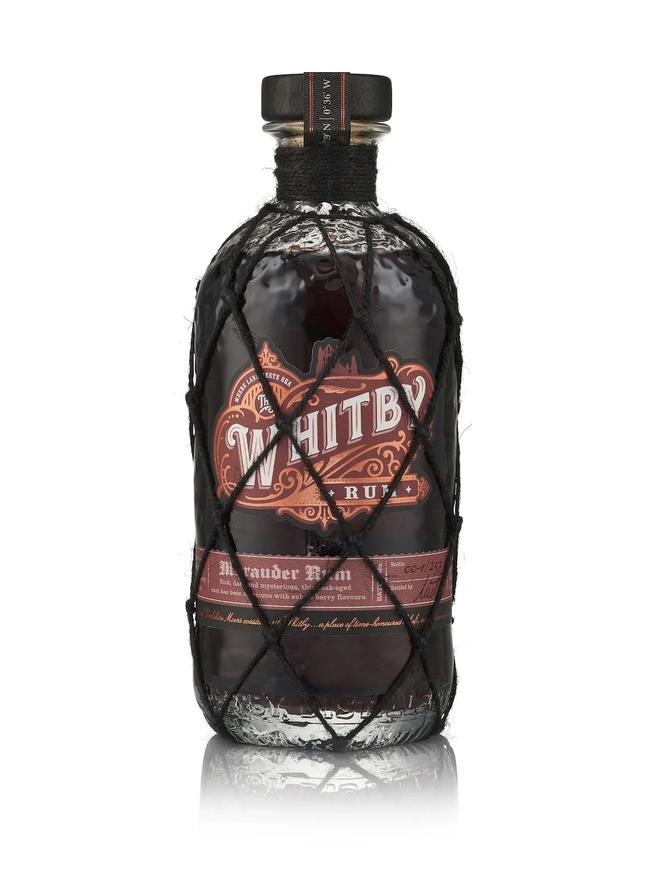 Whitby Marauder Rum: Gothic Dark Cherry Rum Edition, a bottle of rum sitting on a plain white surface. 