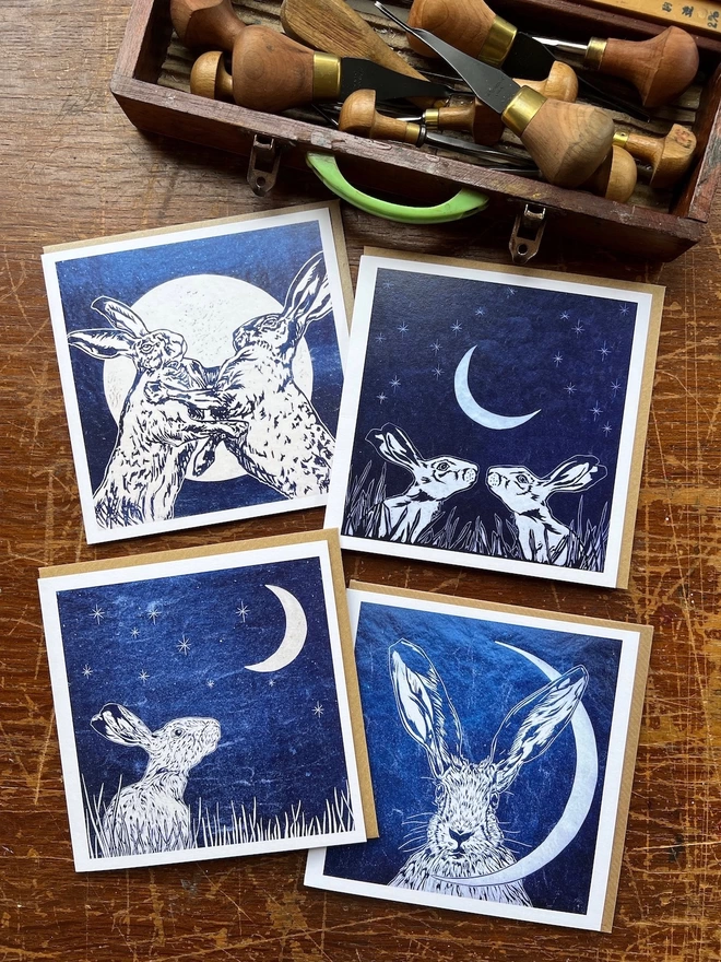 four art cards of hares and moons