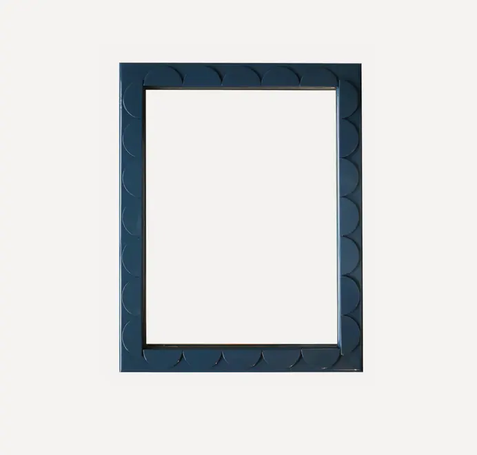 Scallop wood mirror with a scalloped wooden frame on a white background.