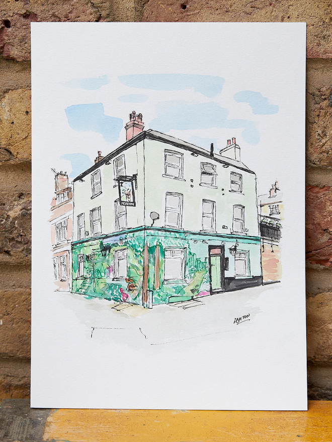 Watercolour painting of a pub leaning against a brick wall
