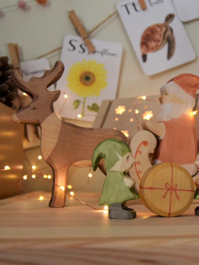 wooden toy reindeer christmas scene photo on toy shelf