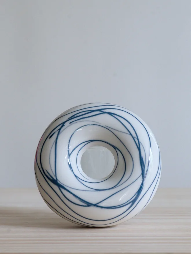 Avocado Planter White & Blue Handmade porcelain avocado planter with carved blue pattern, designed to hold an avocado seed for sprouting