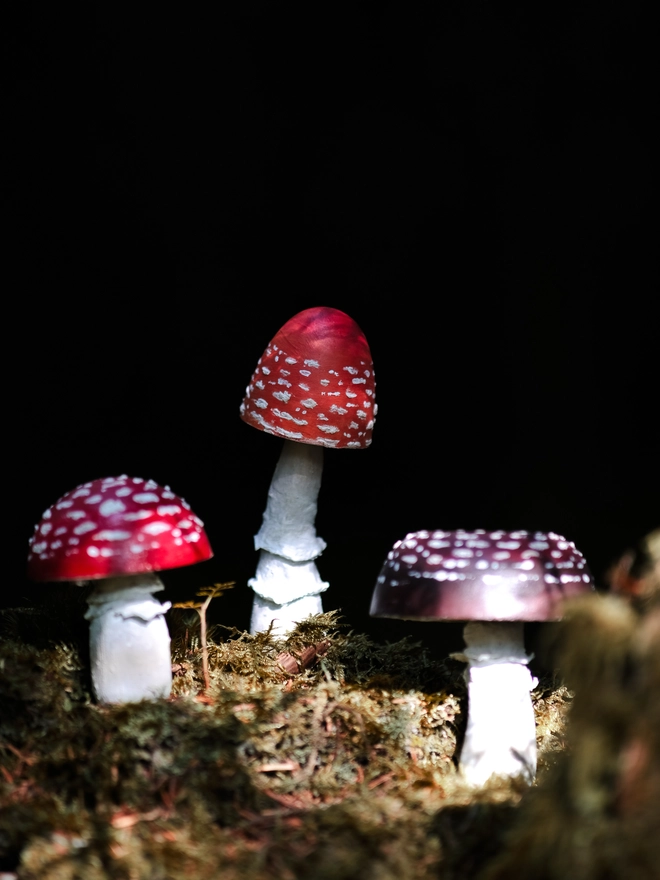 Handmade wooden toadstools and mushroom decorations inspired by enchanted woodland walks
