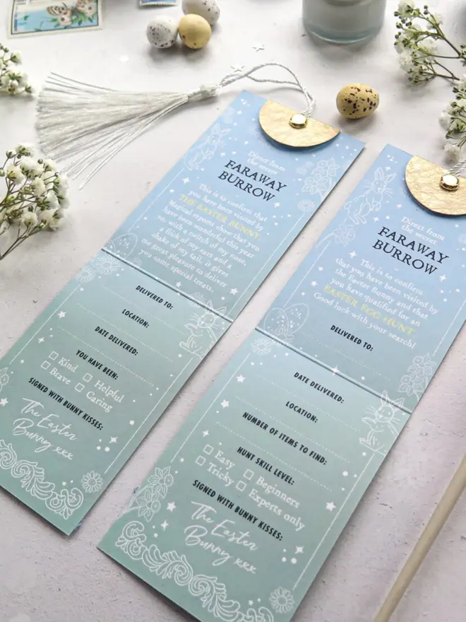 Two blue-to-mint fold-out "Faraway Burrow" cards confirm a visit from the Easter Bunny, one for treats and one for an egg hunt. Each has spaces to fill in the name, location and date, and is signed "with bunny kisses."