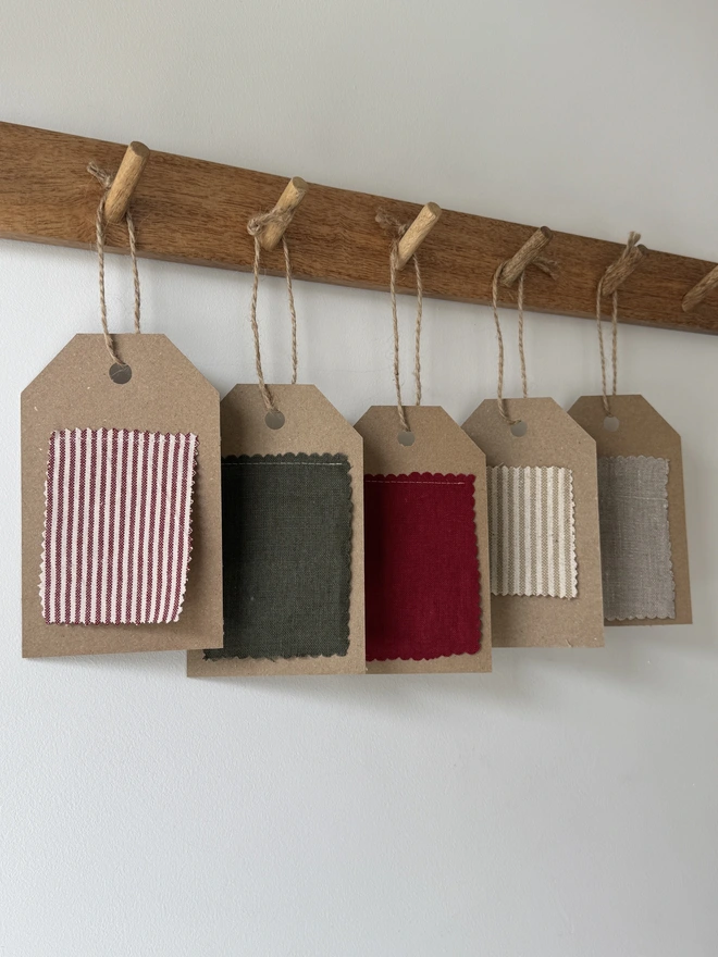 Striped Embroidered Christmas Stocking. A selection of plain and striped linens on a swatch