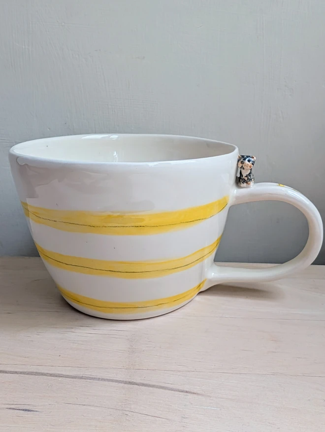 yellow stripy cat cup with personalised tortoise shell cat