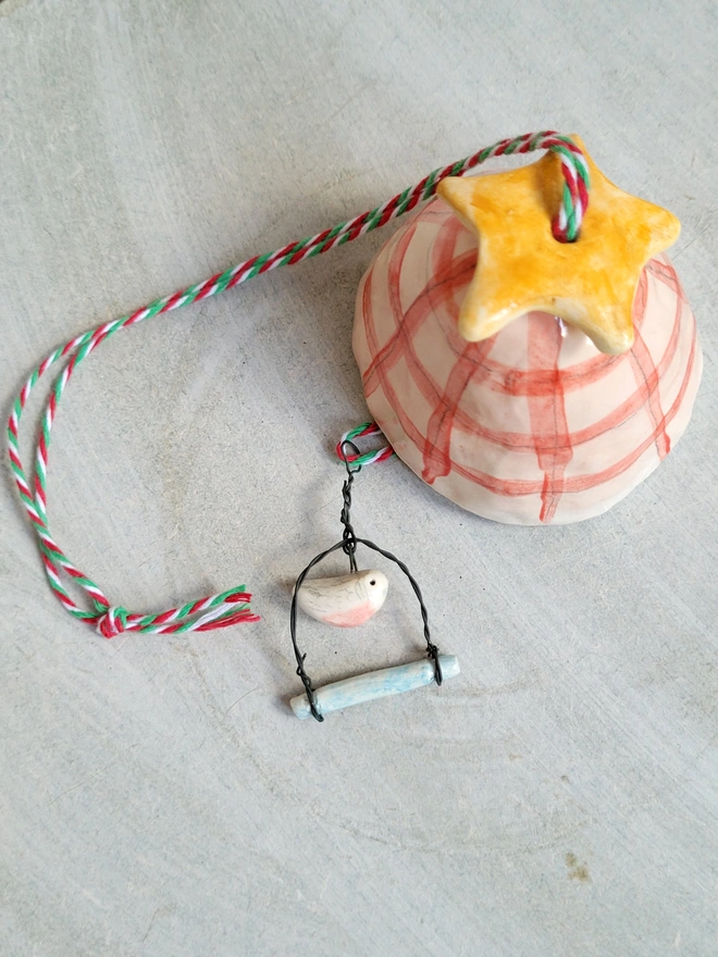 pink ceramic bell with budgie