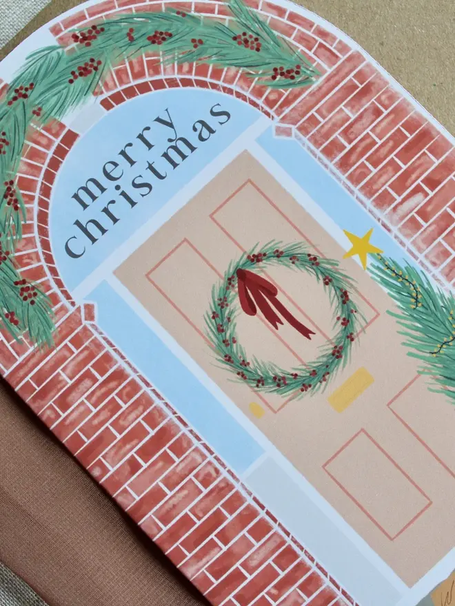 illustrated christmas door card. arch shaped card illustrated with christmas doorframe.