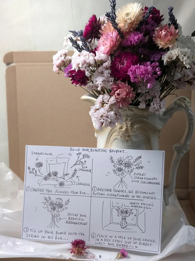 dried flower kit. pink, white and purple dried flower kit assembled into bouquet with instruction sheet..