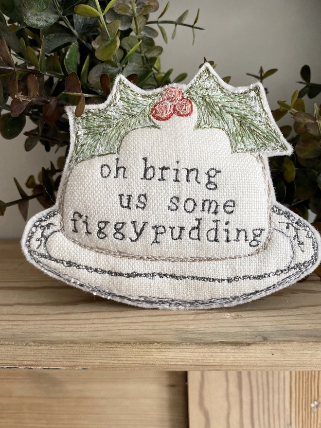 Figgy Pudding Embroidered Fabric Decoration on shelf