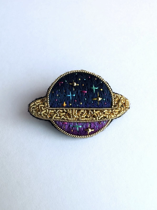 Planet brooch