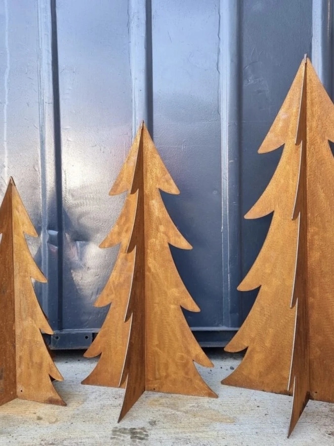 Eternal Fir Trees Decoration, standing in a room as a group. 