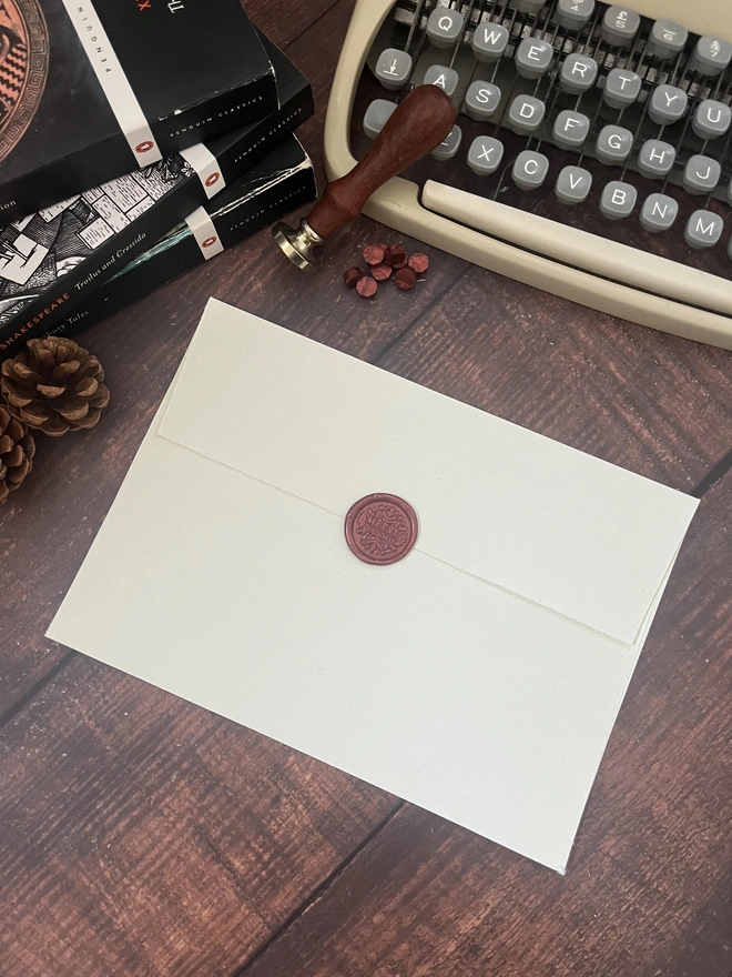 letter to santa, hand typed onto handmade cotton rag paper using an antique typewriter with a merry christmas red wax seal and envelope. 