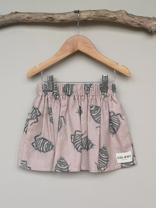 Girls Cotton Linen Pink Woodlouse Print Skirt. Elasticated Waist and Side Seam Pockets.