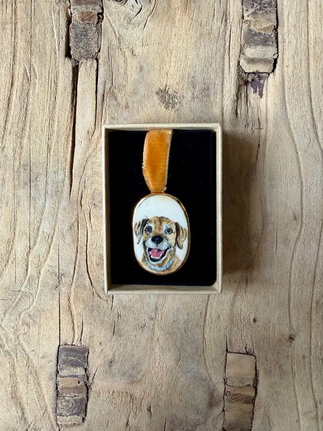 custom pet portrait pendant miniatures. assorted miniature painted dog and cat portraits in pendant frames.