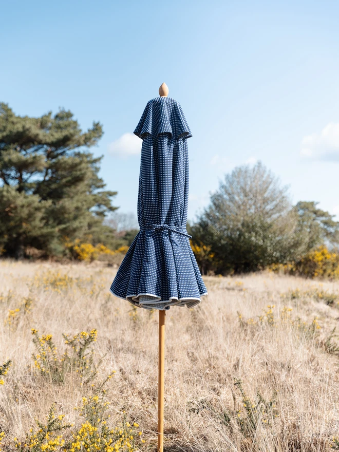 Dots & Dashes Embroidered Parasol. A blue embroidered parasol.