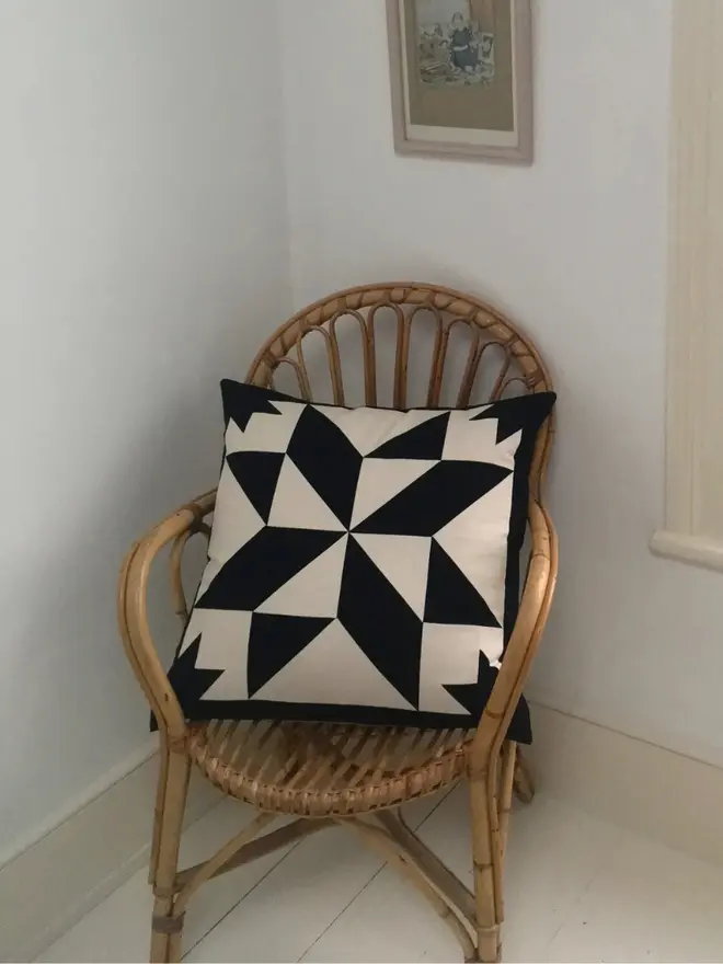 Celest At Night Patchwork Cushion, on a chair. 