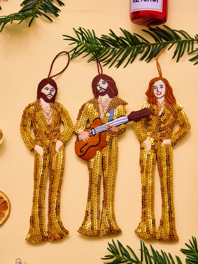 bee gees in sequin outfits as hanging decorations