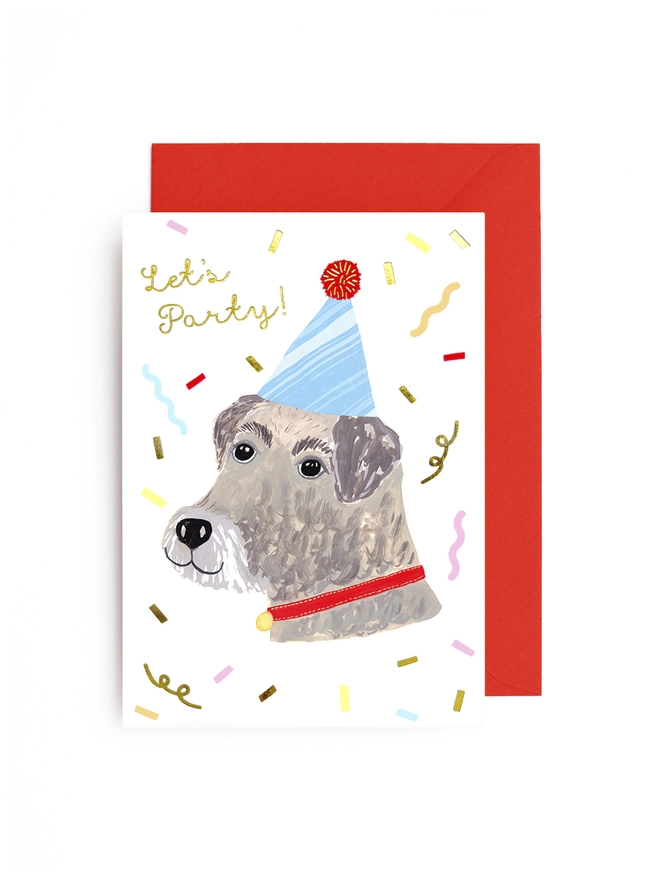 A greeting card featuring a dog wearing a party hat, streamers all around,it says 'Let's Party!'