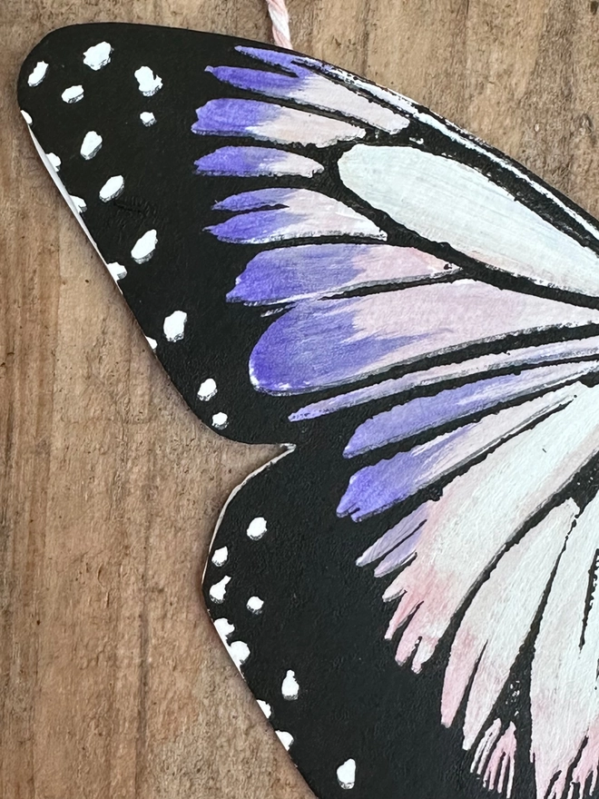 3 Hand Painted Butterflies. Set Of Linocut Wall Hangings. Purple and pink blush coloured butterfly, a close up of it's wing 