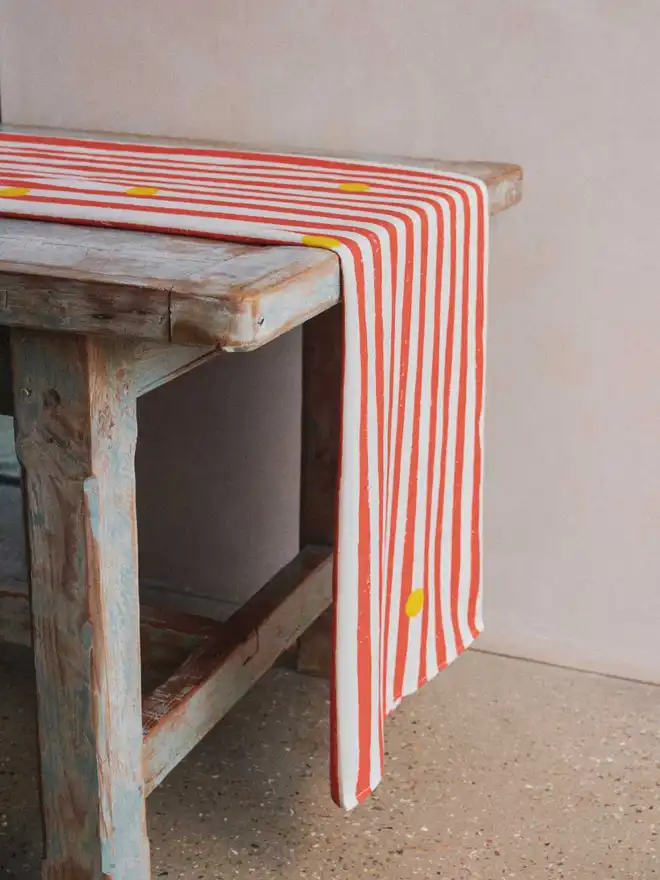 Red stripe yellow dot table runner