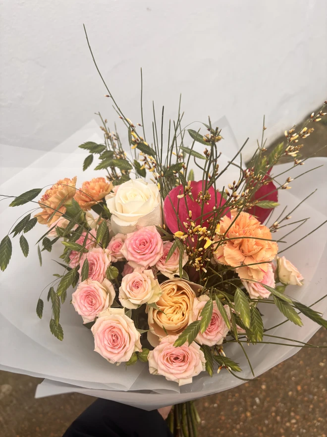 Garden inspired Mothers Day bouquet held Designed and created by Peony Belles 