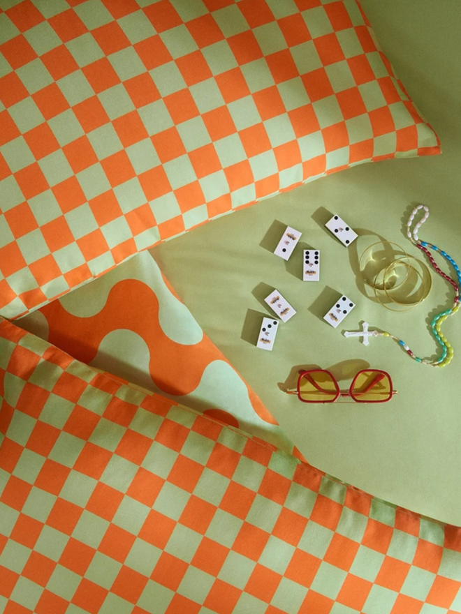 Cubanito Checkerboard Pillowcases. Orange and green checkered pillowcases.