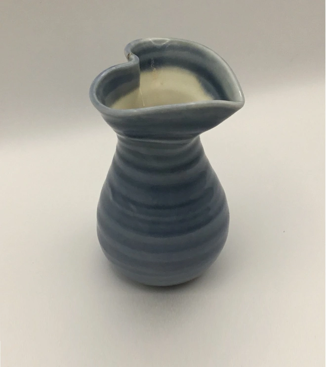 Porcelain Slate Blue Tiny heart shaped vase. These have a heart shape opening and a round base