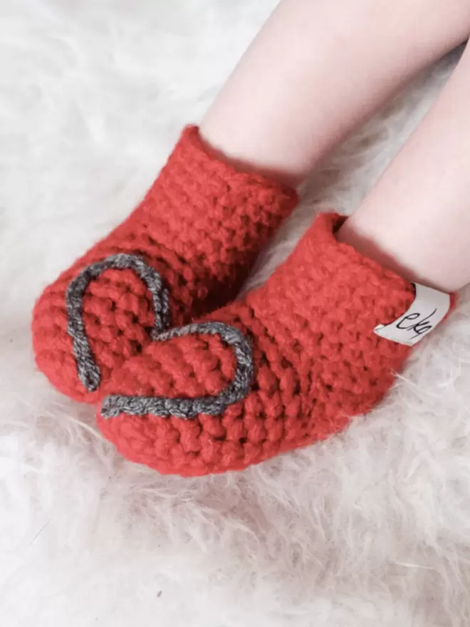 Baby booties with heart embroidery