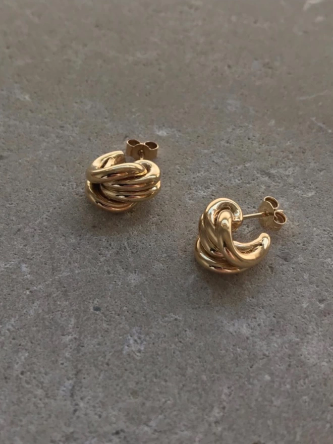 polished gold knotted earrings for ierced ears