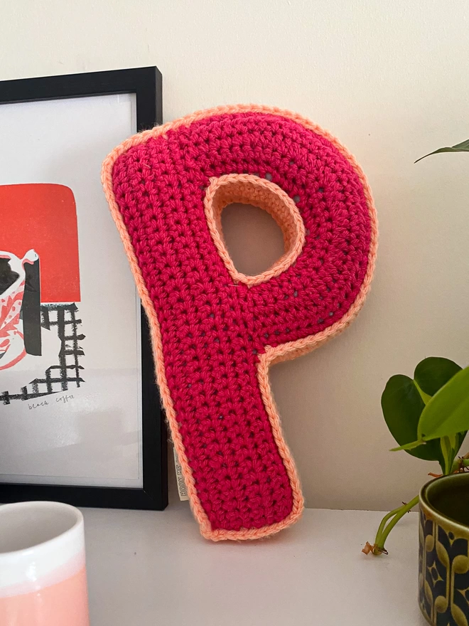 Crocheted P Cushion in Raspberry and Peachy Pink