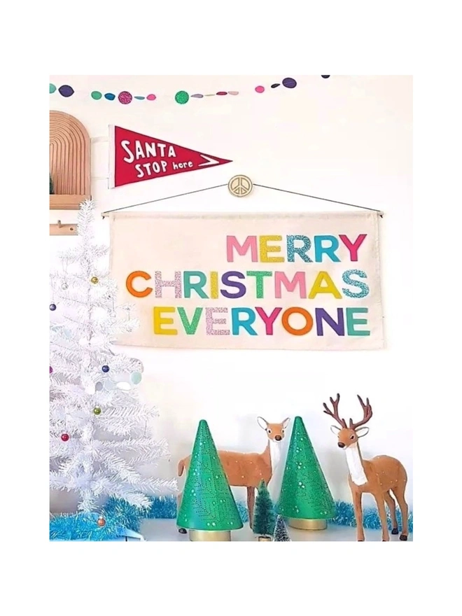 Handmade “Merry Christmas Everyone” banner in bright pop colours. Felt letters on organic cotton – perfect festive wall hanging for Christmas cheer.