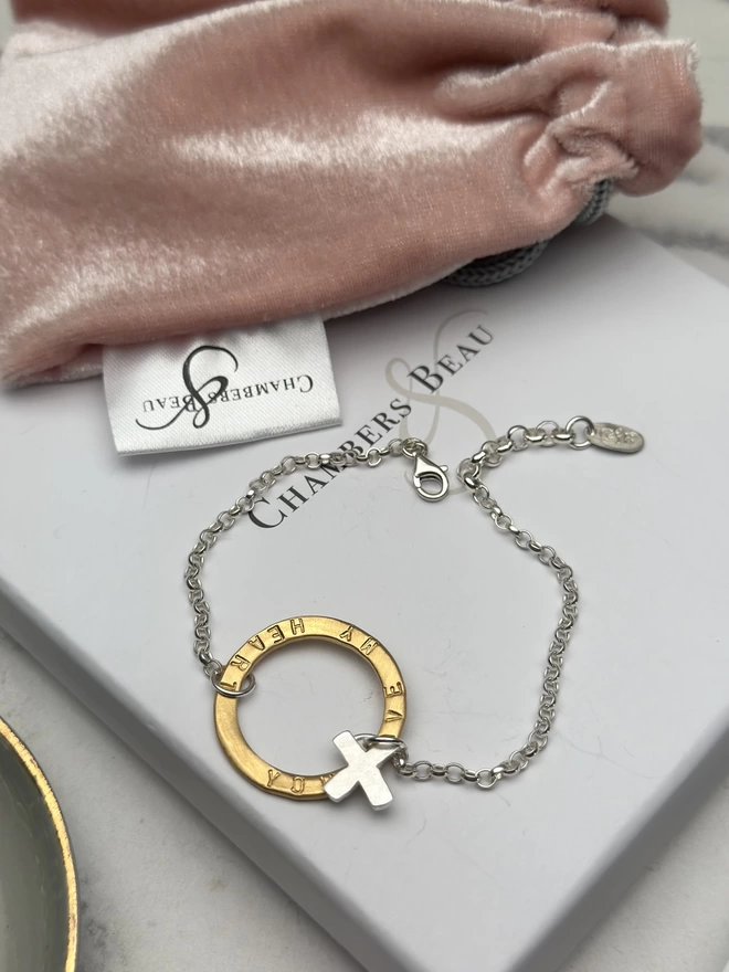 personalised gold halo charm on silver belcher bracelet chain with silver X kiss charm. gift box and pouch