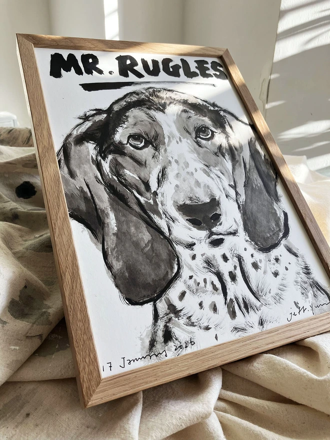 A personalised dog portrait of a basset hound in an oak frame by artist 'Dogs by Jeff'