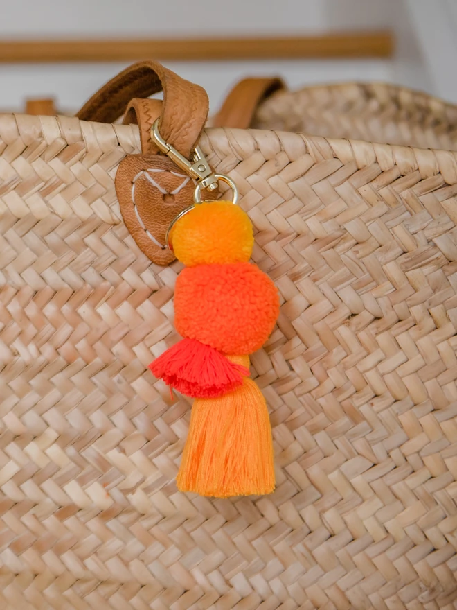 pom pom and tassel keyring bag charm in oranges 