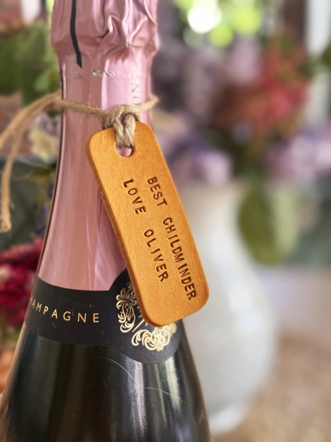 yellow leather teacher label on a bottle of champagne