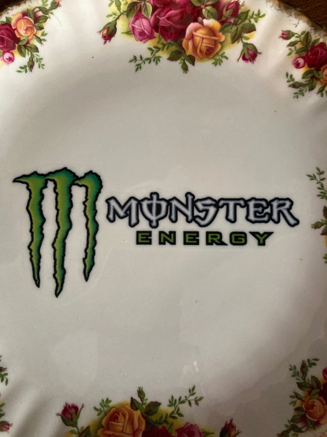 Vintage floral plate featuring the 'Monster Energy' logo