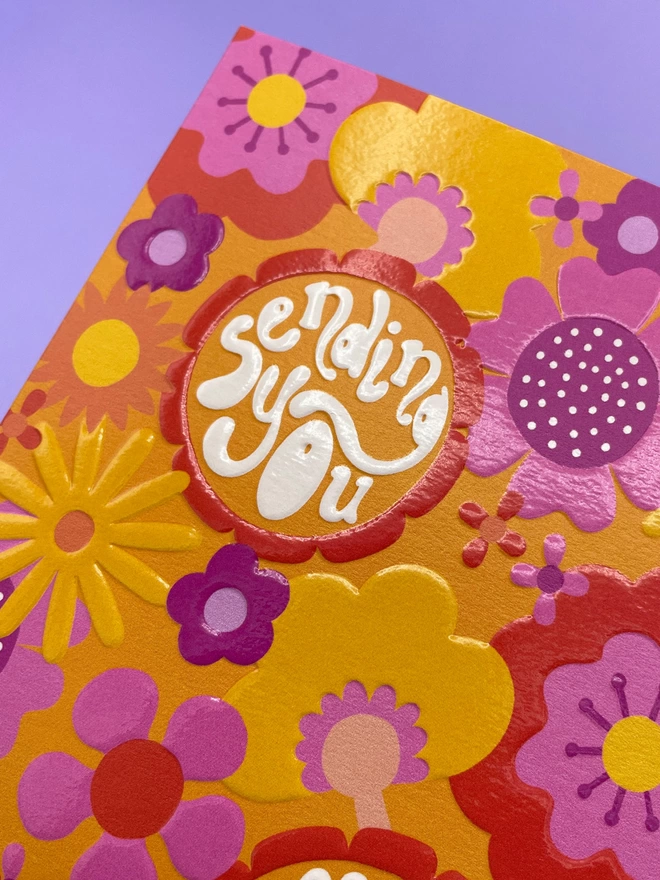 Detailed image of the spot UV and emboss finish that really enhances the Raspberry Blossom greetings card design  