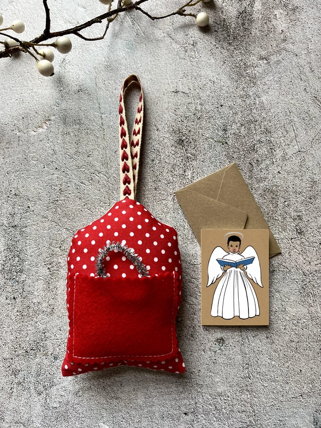 a mini greeting card featuring an Afro Caribbean little angel boy choir singer